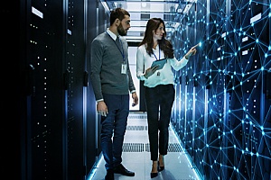 business officials working in a data server room