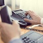 a business phone being used by an employee