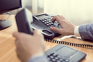 a business phone being used by an employee