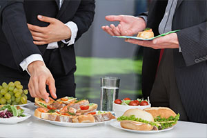 two businessmen enjoying lunch