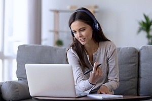 a teleworker meeting with her boss online