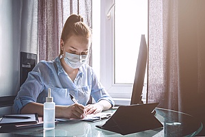 a woman performing remote work during the COVID-19 outbreak