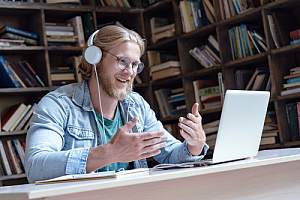 IT worker helping clients in a remote setting 