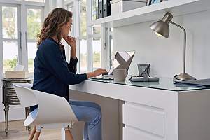 Woman working remotely at desk