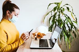 Small business owner practicing safe cyber security 
