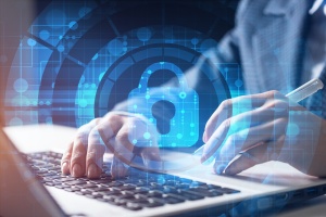 man on computer with security 