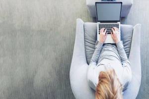 women on laptop looking at The State Of the Internet Of Things