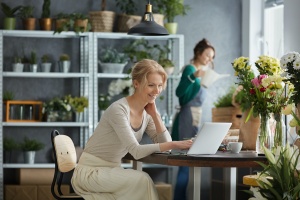 women on her computer doing business work