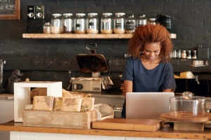 women working in her small business cafe