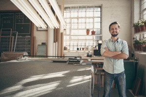 man standing in his small business