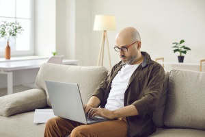 man working on digital decluttering