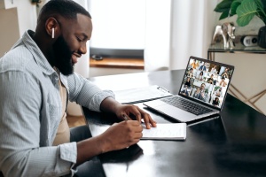 man in meeting while working for a Virtual Company