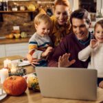 Family gathered around computer during Thanksgiving dinner