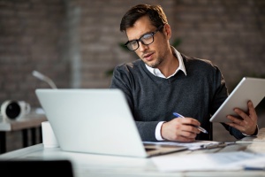 Businessman using wireless technology while working on Cybersecurity