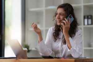 Business woman talking phone at office space. real estate, lawyer, non-profit, marketing