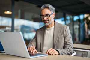 man working at his Hybrid Work Model for Small Businesses