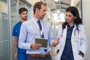 Doctor in a conversation about Outsourced IT Support for Your Healthcare Business