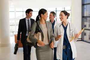 Doctors and business people talking